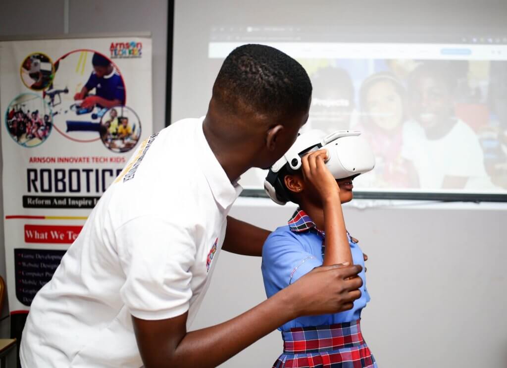 An Image of a facilitator and student with VR headset at the  student innovation center Poano